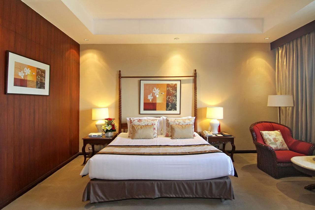 The Manila Hotel Exterior foto A bedroom at the hotel