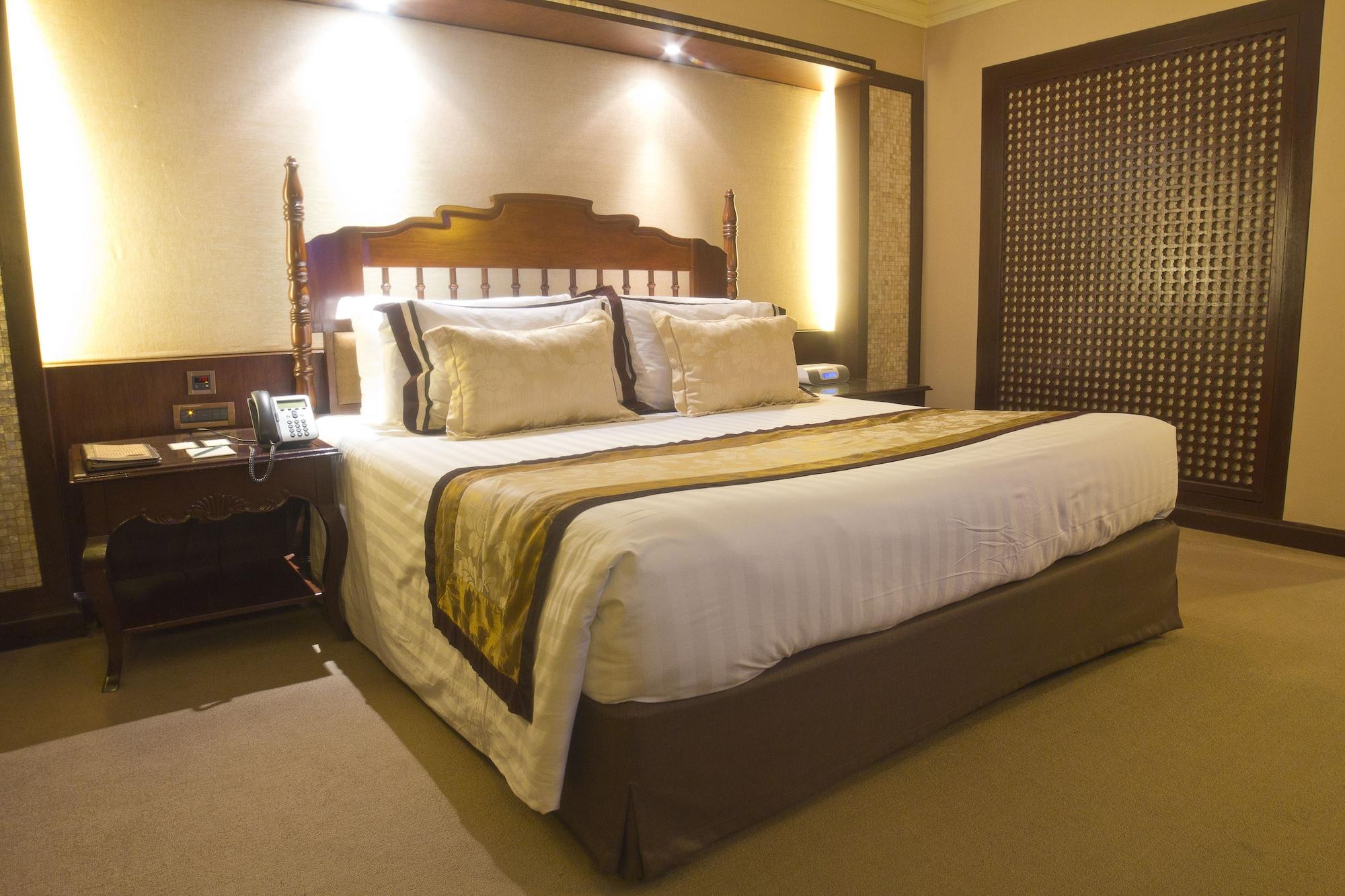 The Manila Hotel Exterior foto A bedroom